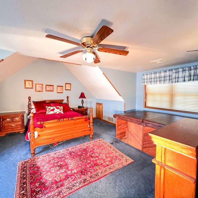 carpeted bedroom featuring visible vents, a ceiling fan, and vaulted ceiling
