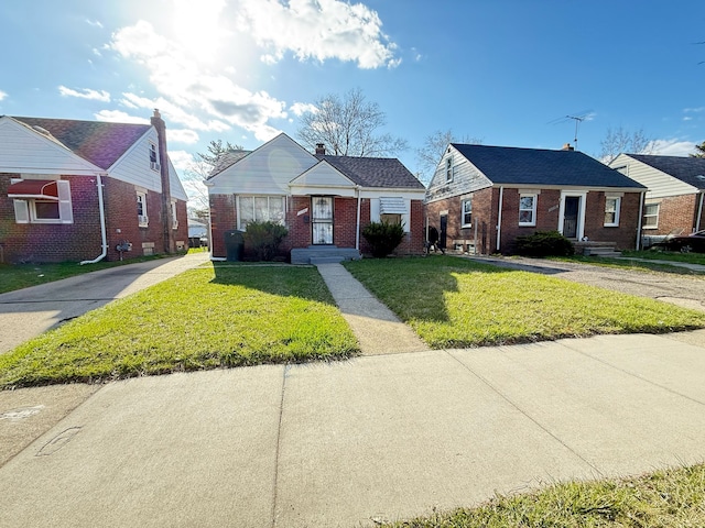 20561 Alcoy St, Detroit, MI 48205 - bungalow with brick siding and a front lawn