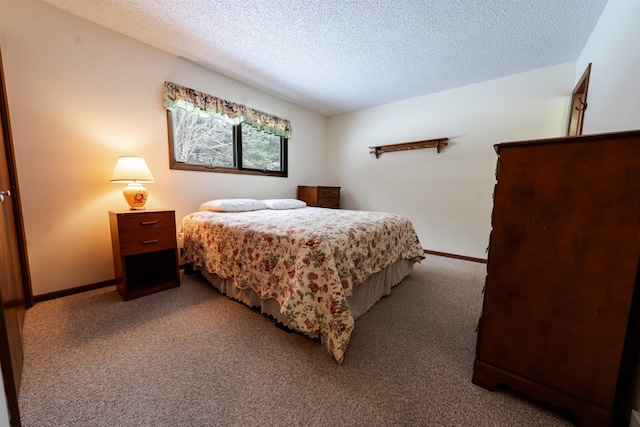 bedroom featuring baseboards, carpet flooring, and a textured ceiling