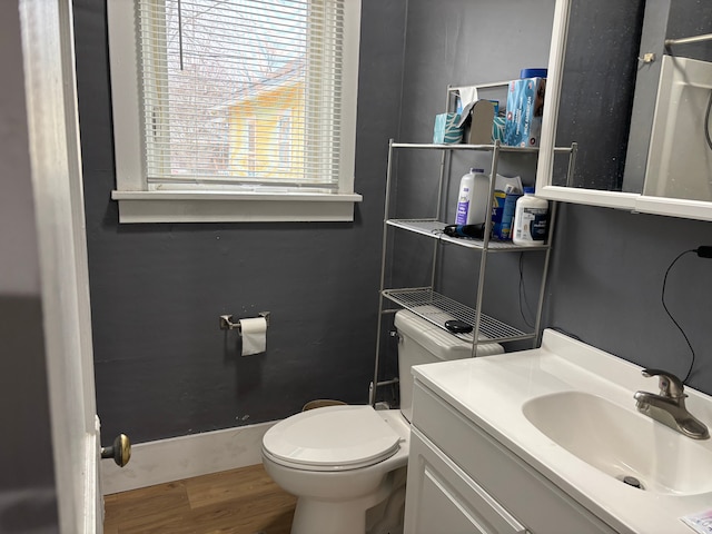 1720 White St, Port Huron, MI 48060 - half bath with wood finished floors, toilet, and vanity