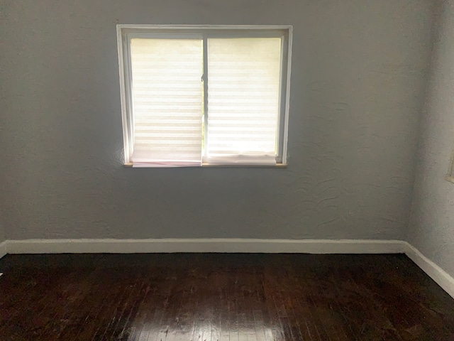 14839 Rutherford St, Detroit, MI 48227 - empty room featuring baseboards and hardwood / wood-style flooring
