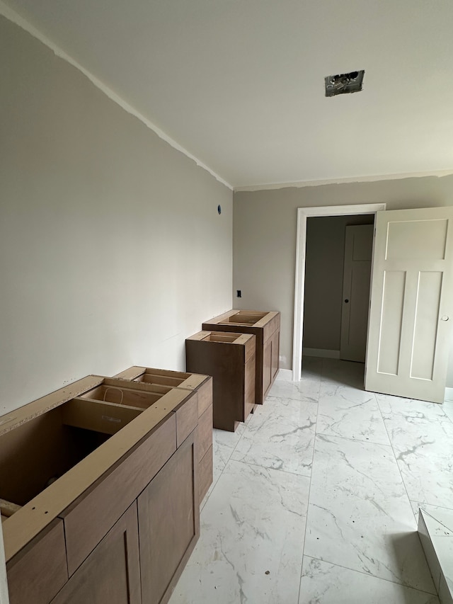 kitchen with marble finish floor
