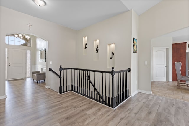 18277 Crenshaw Dr, Macomb, MI 48042 - foyer featuring wood finished floors, arched walkways, and baseboards