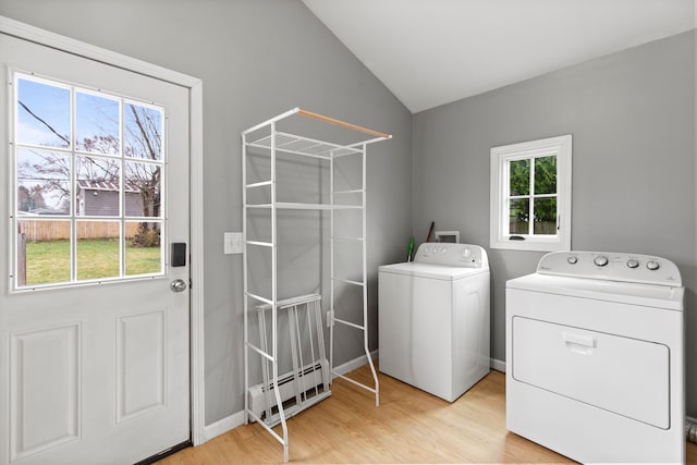 142 E Glass Rd, Ortonville, MI 48462 - laundry area with independent washer and dryer, plenty of natural light, a baseboard heating unit, and laundry area