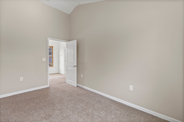 142 E Glass Rd, Ortonville, MI 48462 - unfurnished room with baseboards, high vaulted ceiling, and light colored carpet