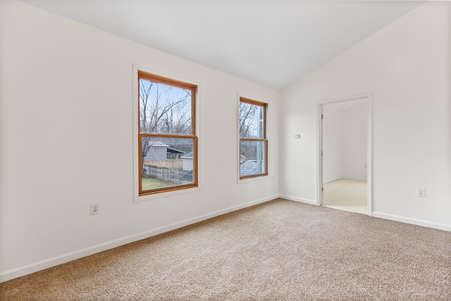 142 E Glass Rd, Ortonville, MI 48462 - empty room featuring baseboards, lofted ceiling, and carpet flooring