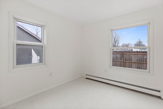 142 E Glass Rd, Ortonville, MI 48462 - empty room featuring a baseboard radiator, carpet, and baseboards