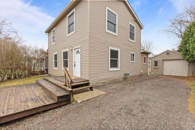 142 E Glass Rd, Ortonville, MI 48462 - rear view of house with an outbuilding, a garage, and crawl space