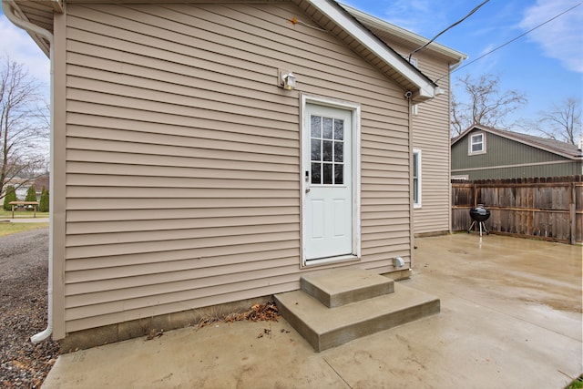 142 E Glass Rd, Ortonville, MI 48462 - property entrance with fence and a patio area