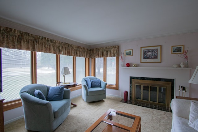 carpeted living room with a fireplace with flush hearth, crown molding, and baseboards