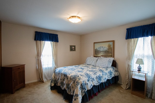 bedroom with light carpet
