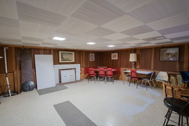 interior space featuring visible vents and wooden walls
