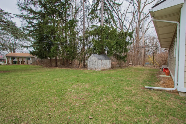 view of yard featuring an outbuilding and a shed