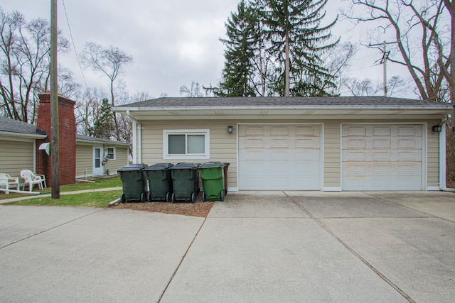 garage with concrete driveway