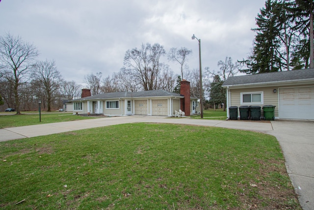 single story home with a chimney, driveway, a garage, and a front lawn