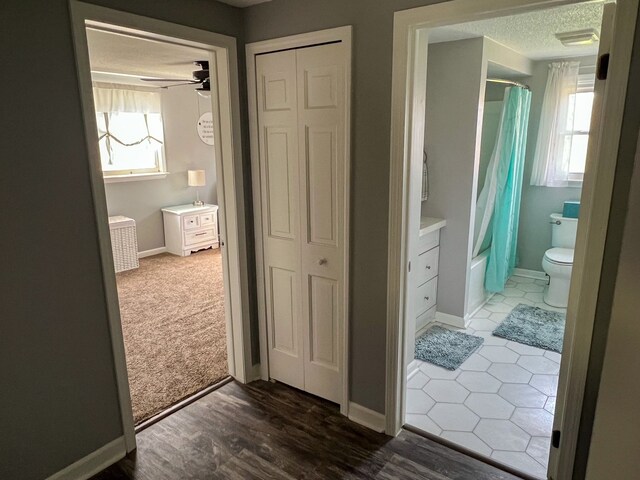 6201 E Holly Rd, Holly, MI 48442 - full bathroom with a textured ceiling, a wealth of natural light, shower / bath combination with curtain, and a closet