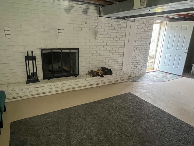 6201 E Holly Rd, Holly, MI 48442 - below grade area featuring a brick fireplace