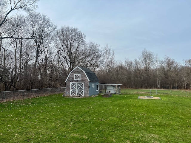 6201 E Holly Rd, Holly, MI 48442 - view of yard with an outdoor structure, a fire pit, a barn, and fence
