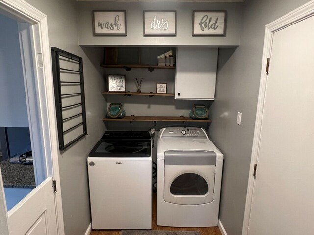6201 E Holly Rd, Holly, MI 48442 - clothes washing area featuring washer and clothes dryer, laundry area, and baseboards