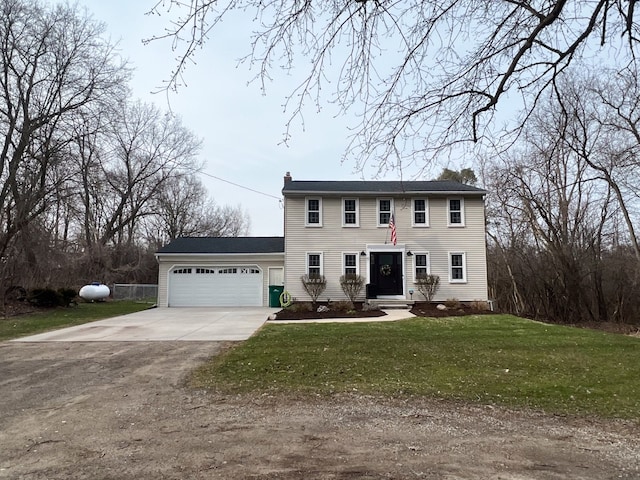 6201 E Holly Rd, Holly, MI 48442 - colonial home featuring a chimney, a garage, a front lawn, and concrete driveway