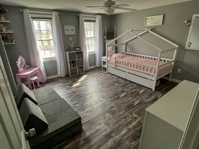 6201 E Holly Rd, Holly, MI 48442 - bedroom featuring a ceiling fan, wood finished floors, and a textured ceiling
