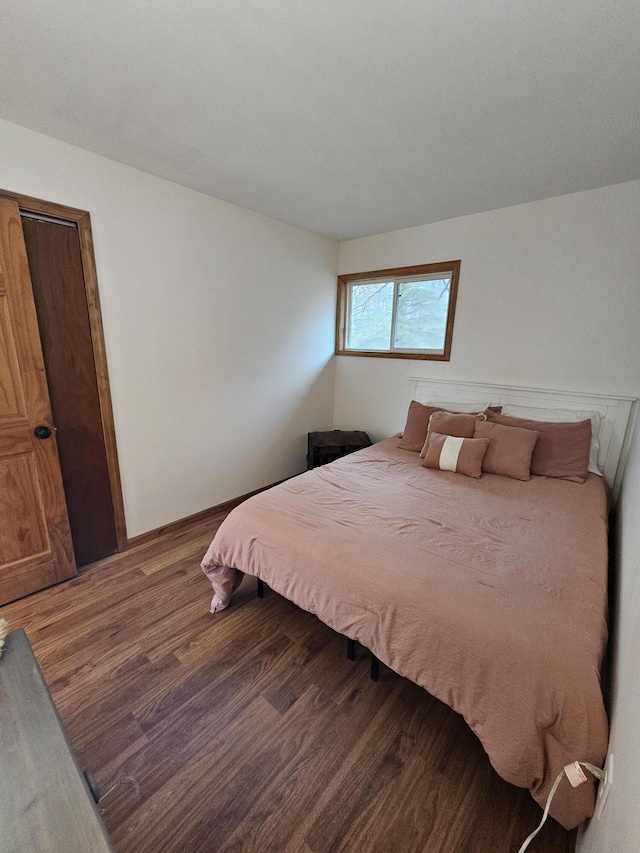 bedroom featuring wood finished floors