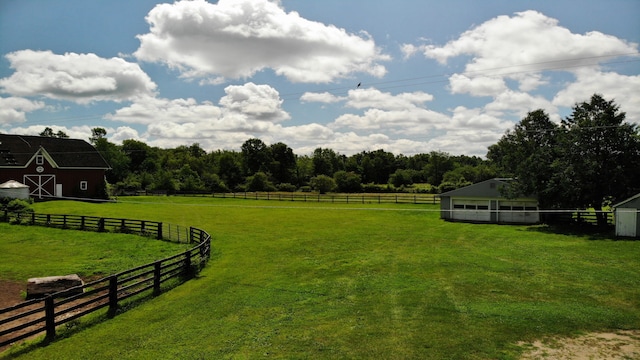 8162 Groveland Rd, Holly, MI 48442 - view of yard with a barn, an outdoor structure, and a rural view