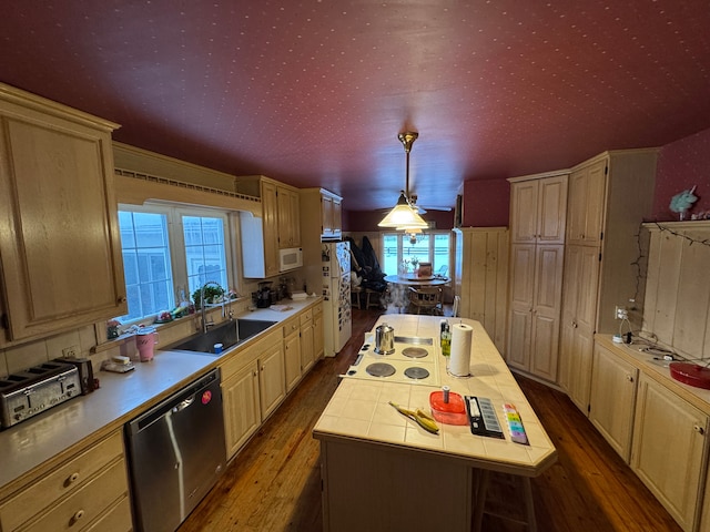 8162 Groveland Rd, Holly, MI 48442 - kitchen with white appliances, a sink, dark wood-style flooring, and a center island