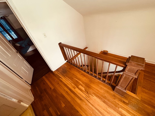 8162 Groveland Rd, Holly, MI 48442 - stairway with hardwood / wood-style flooring and baseboards