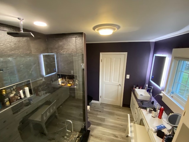 8162 Groveland Rd, Holly, MI 48442 - bathroom with a stall shower, wood finished floors, vanity, and crown molding