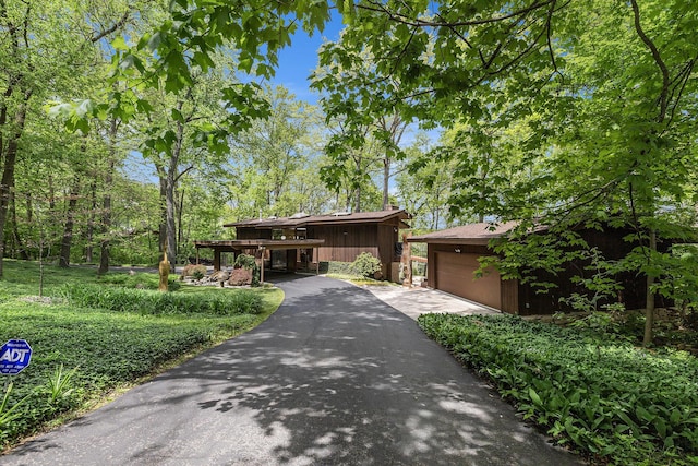 403 Riverview Dr, Ann Arbor, MI 48104 - mid-century inspired home with asphalt driveway and a garage