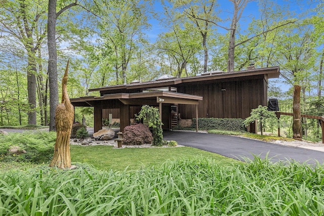 403 Riverview Dr, Ann Arbor, MI 48104 - view of front of home featuring asphalt driveway and a chimney