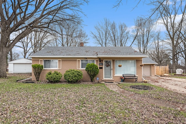 single story home featuring concrete driveway, fence, an attached garage, brick siding, and a chimney