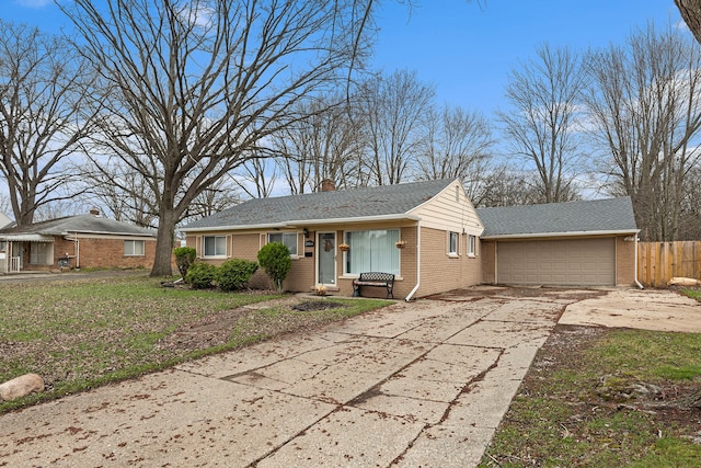 ranch-style home featuring fence, driveway, an attached garage, and brick siding