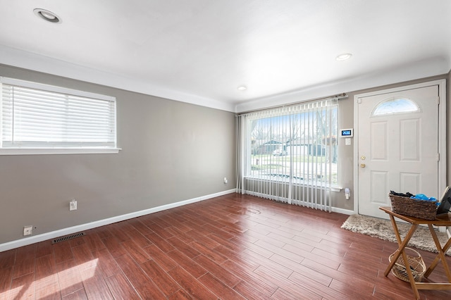 entrance foyer with recessed lighting, visible vents, baseboards, and dark wood finished floors