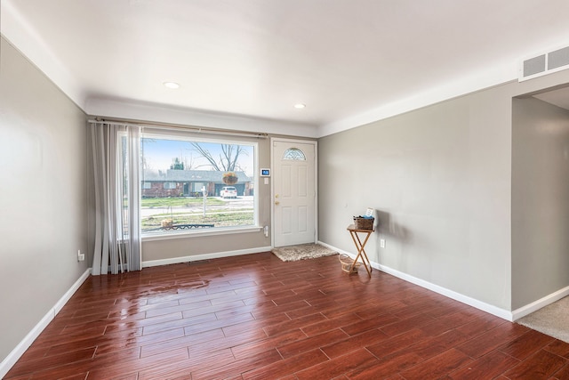 foyer with baseboards, visible vents, wood finished floors, and recessed lighting