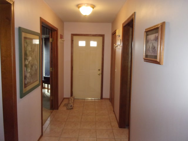 corridor featuring light tile patterned floors