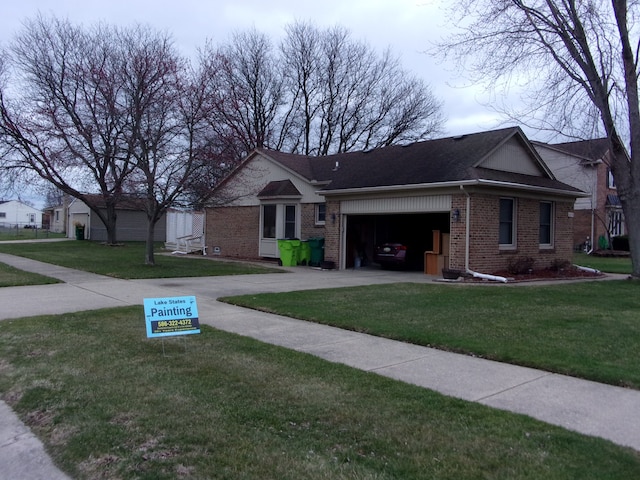 view of front facade featuring concrete driveway, roof with shingles, an attached garage, a front yard, and brick siding