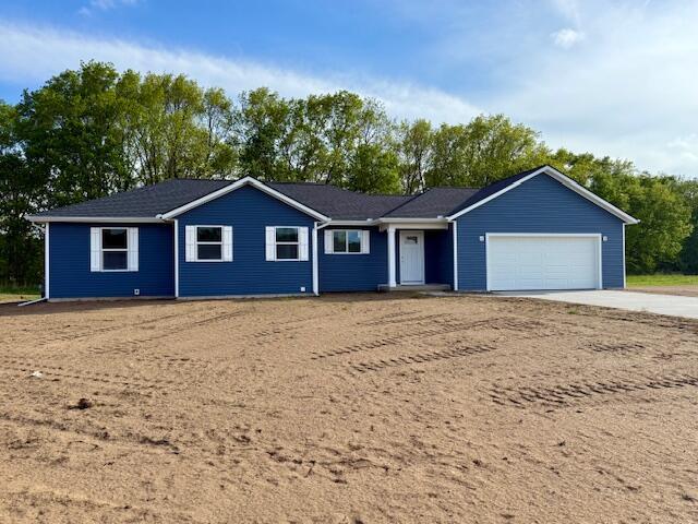 3220 Signal Point Dr, Allegan, MI 49010 - single story home featuring concrete driveway and an attached garage