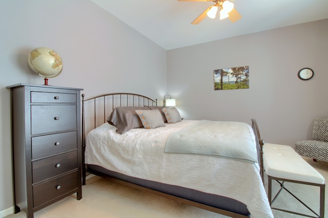 bedroom with a ceiling fan and light carpet