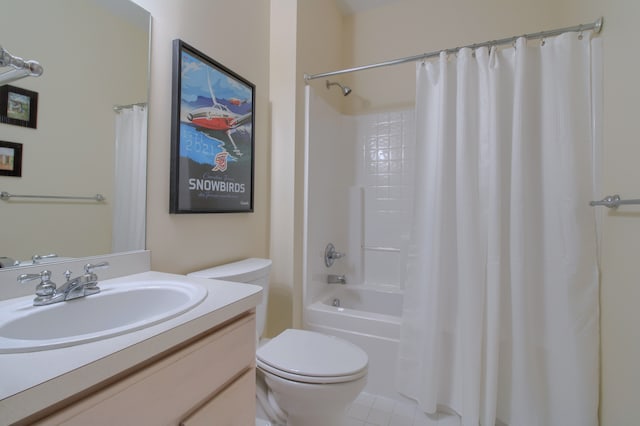 bathroom with toilet, tile patterned floors, shower / bath combo with shower curtain, and vanity