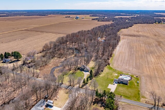 birds eye view of property with a rural view