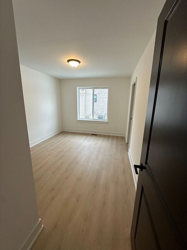 21812 Duns Scotus St # 7, Southfield, MI 48075 - spare room featuring light wood-style floors and baseboards