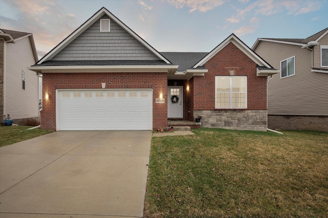 30909 Asbury Hill Ct, New Hudson, MI 48165 - view of front of property featuring driveway, a front yard, an attached garage, and brick siding