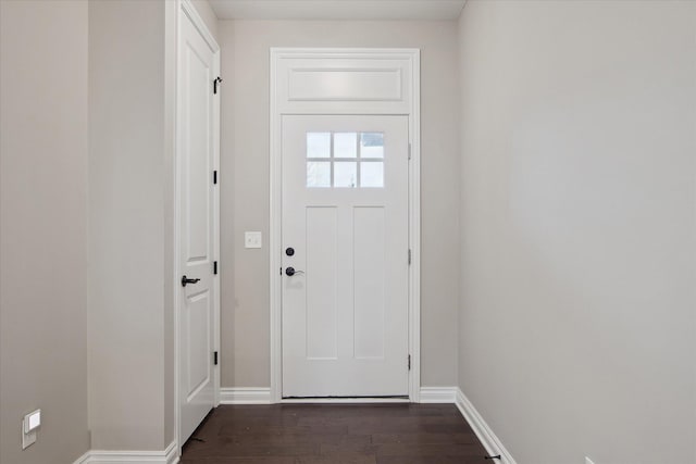 30909 Asbury Hill Ct, New Hudson, MI 48165 - doorway to outside with baseboards and dark wood-type flooring
