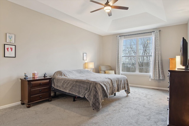 30909 Asbury Hill Ct, New Hudson, MI 48165 - carpeted bedroom featuring baseboards, ceiling fan, and a raised ceiling