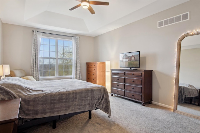 30909 Asbury Hill Ct, New Hudson, MI 48165 - carpeted bedroom featuring a tray ceiling, baseboards, ceiling fan, and visible vents