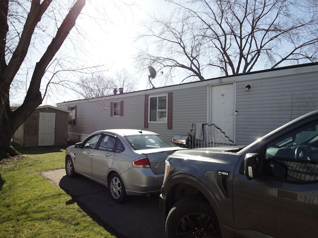 22025 Duvall, Romulus, MI 48174 - view of front of home featuring an outbuilding and a storage unit