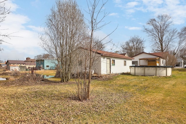 2981 Harrison St, Saginaw, MI 48604 - exterior space featuring a yard and a covered pool