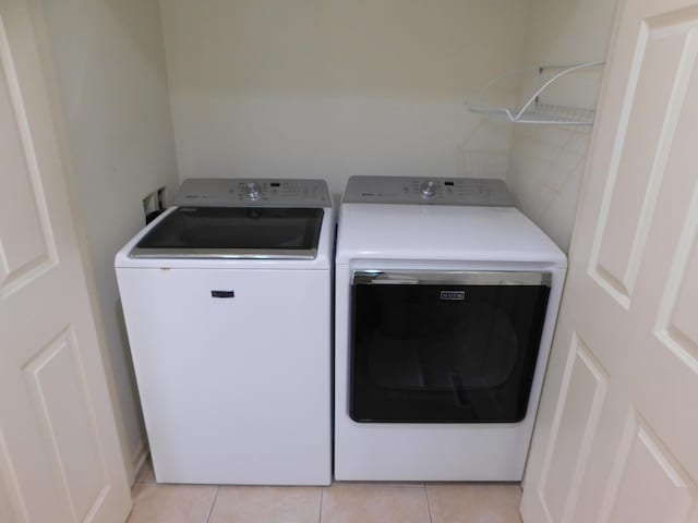 2535 Holiday House Rd Unit 24, Saint Joseph, MI 49085 - laundry area with independent washer and dryer and light tile patterned flooring
